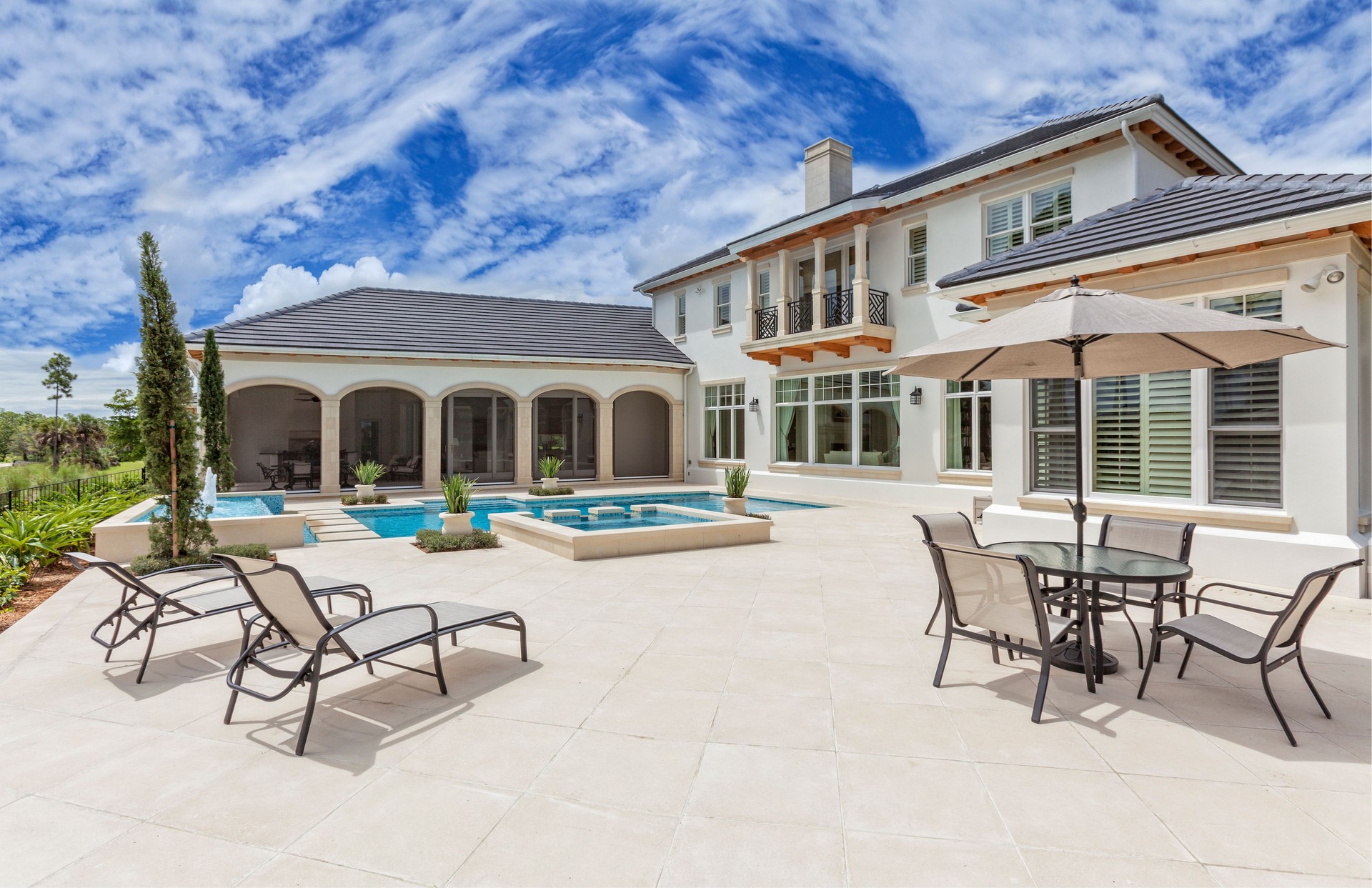 Outdoor Patio with Furniture and Swimming Pool at Estate Home