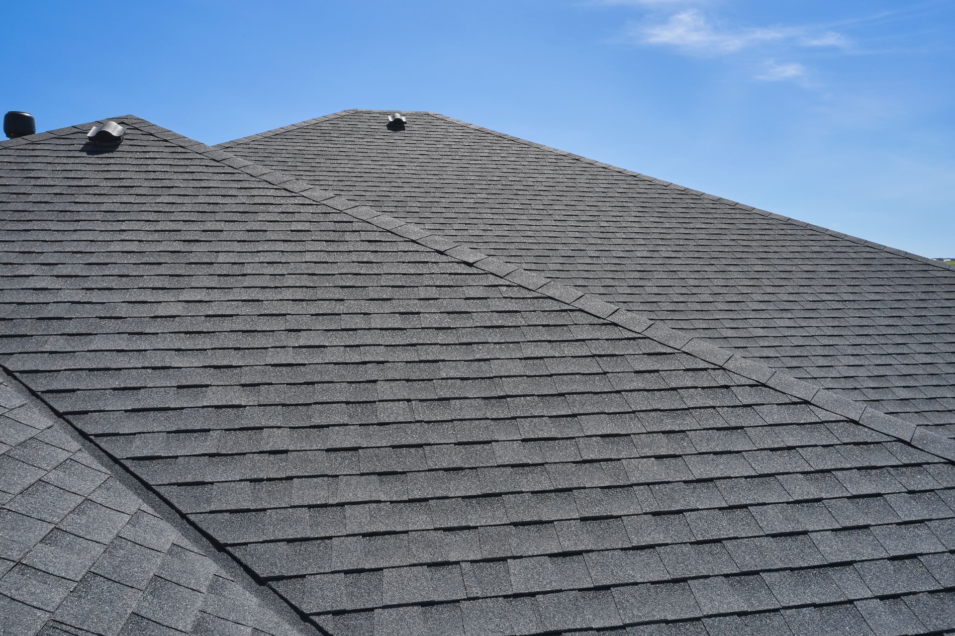 Roof of the house made of bitumen roof shingles aerial view